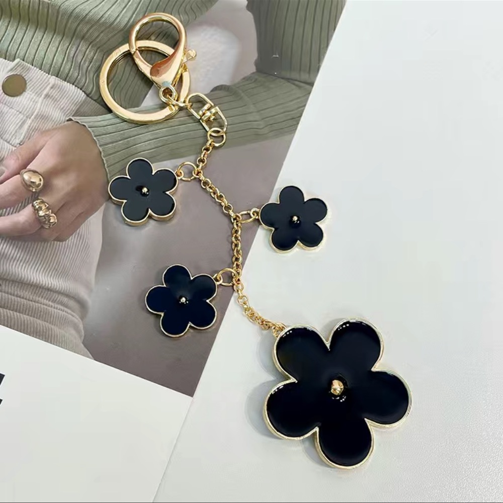 NIB Floral keychain or purse charm with clip. Black one